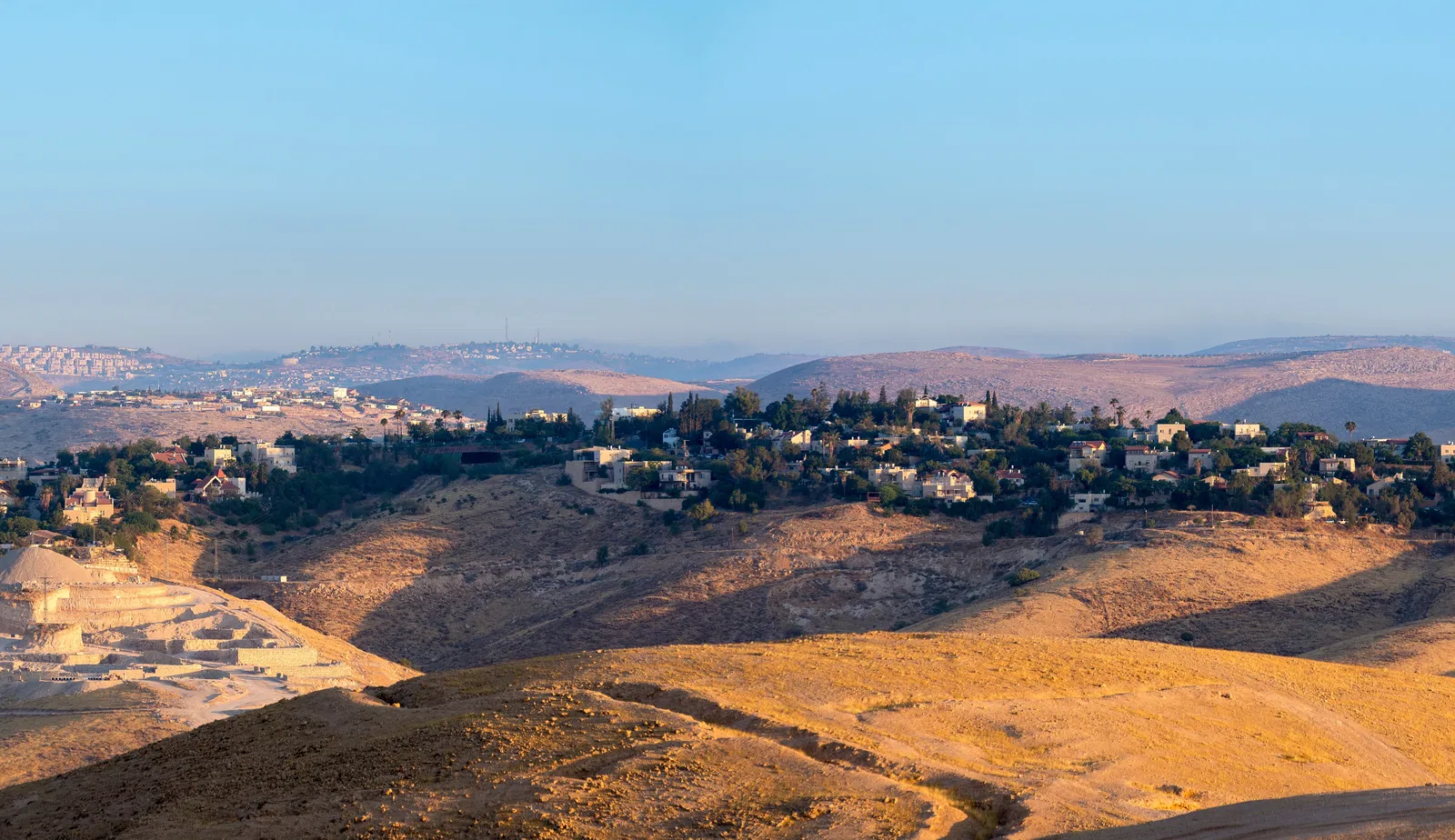 A photo of Binyamin taking from on top of a hill.